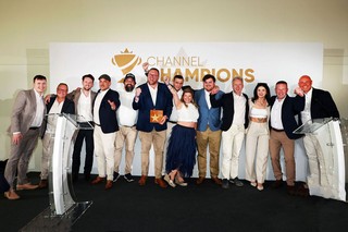 Winners of an award holding a trophy