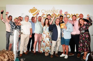 Winners of an award holding a trophy