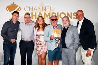 Winners of an award holding a trophy