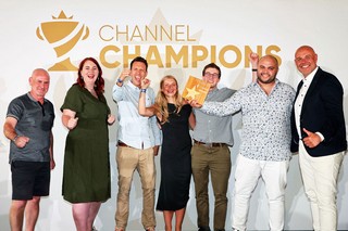 Winners of an award holding a trophy