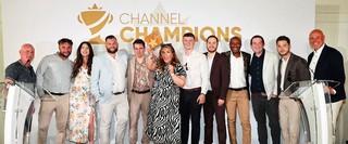 Winners of an award holding a trophy