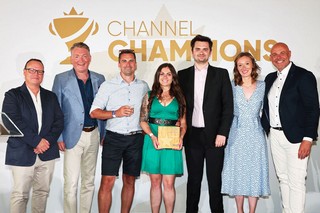 Winners of an award holding a trophy
