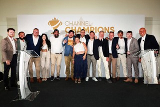 Winners of an award holding a trophy