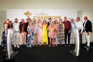 Winners of an award holding a trophy