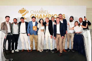 Winners of an award holding a trophy
