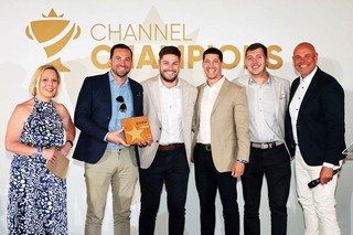 Winners of an award holding a trophy