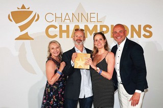 Winners of an award holding a trophy