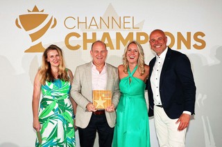 Winners of an award holding a trophy